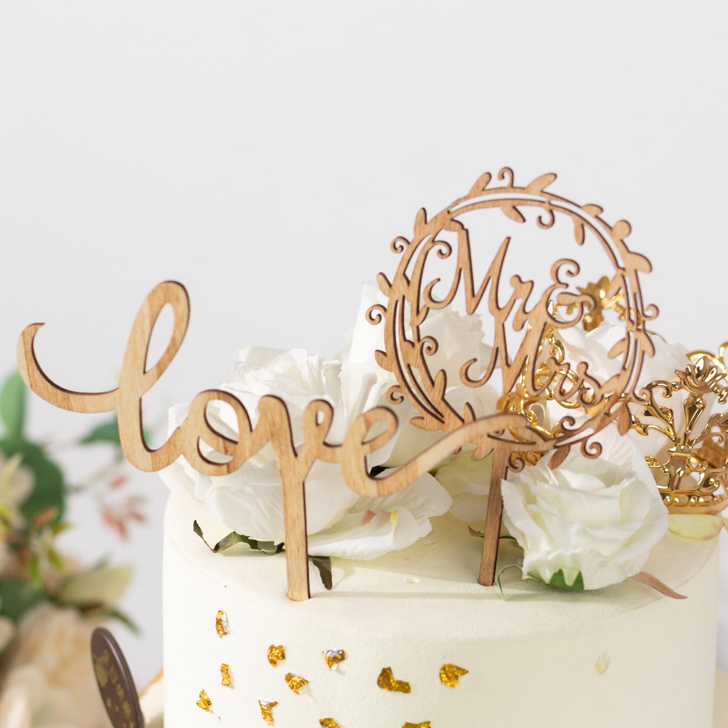 Rustic wooden Mr & Mrs and Love wedding cake toppers.