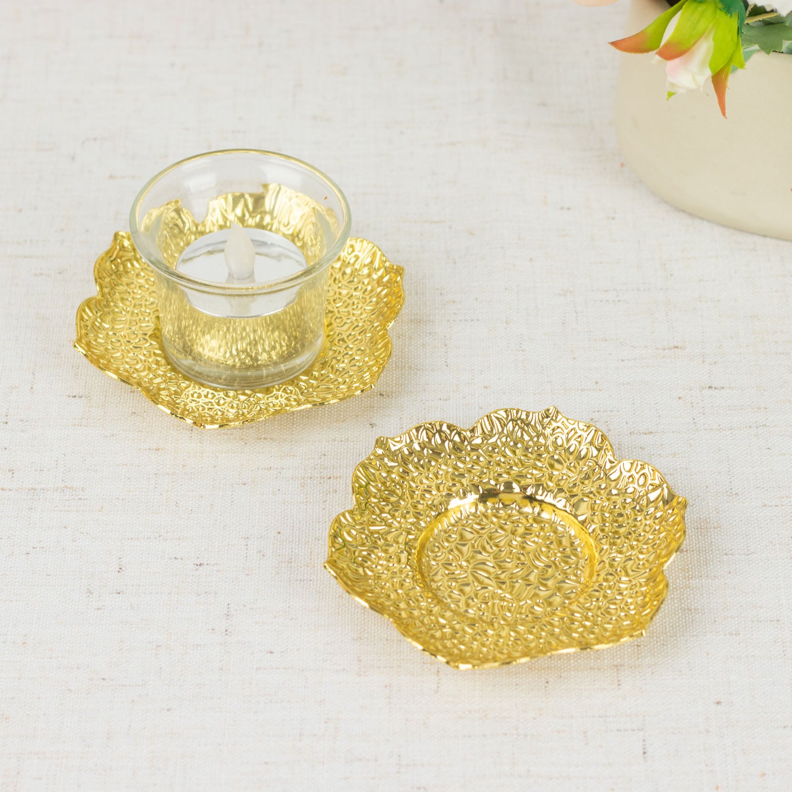 Shiny gold plum blossom tealight candle holders in vintage mini tea cup saucers.