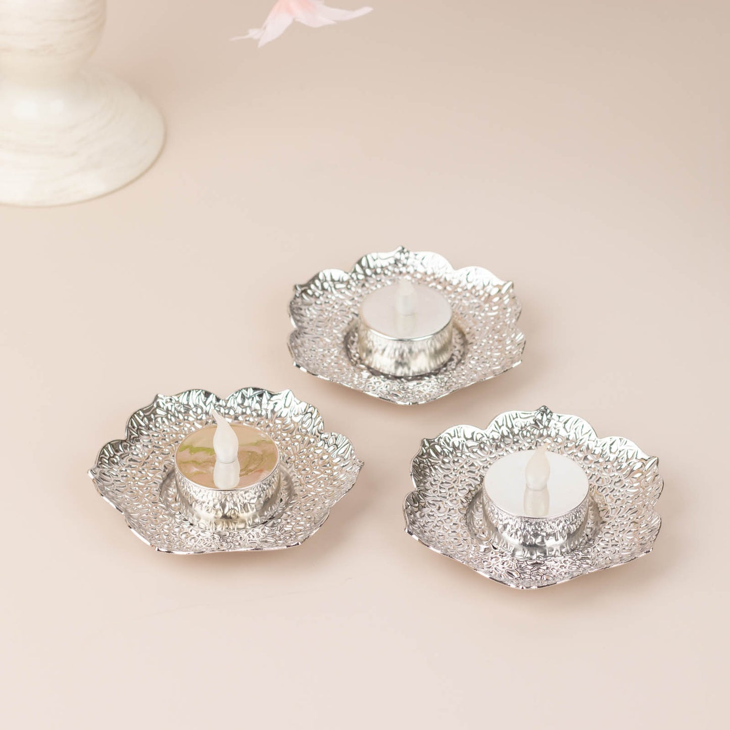 Shiny silver plum blossom tealight candle holders, vintage mini tea cup saucers.