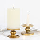 Gold metal candle holders for pillar and taper candles.