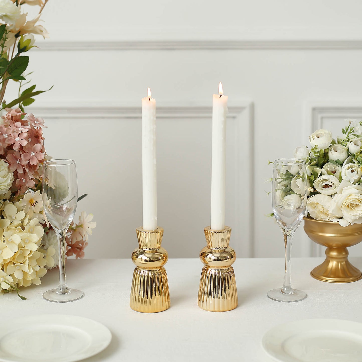 5" Metallic Gold Fluted Ball Neck Ceramic Taper Candle Holders with white candles.