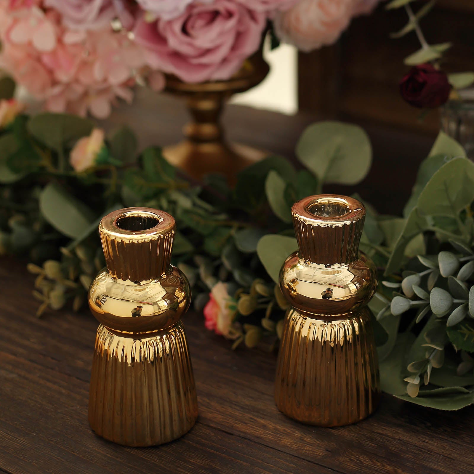 Metallic gold fluted ball neck ceramic taper candle holders, ribbed design.