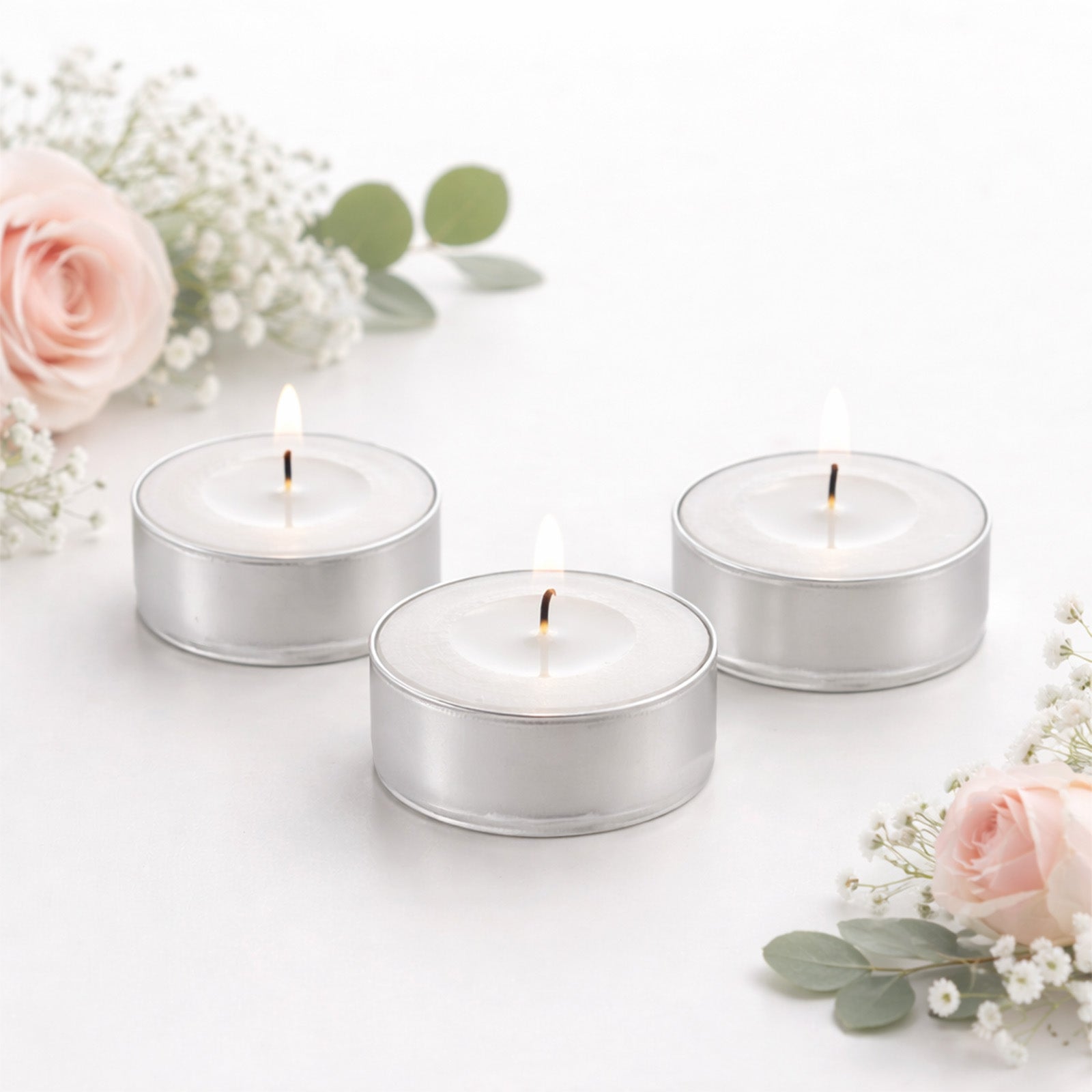 White unscented tealight candles in metal cups, clean burning and smokeless.