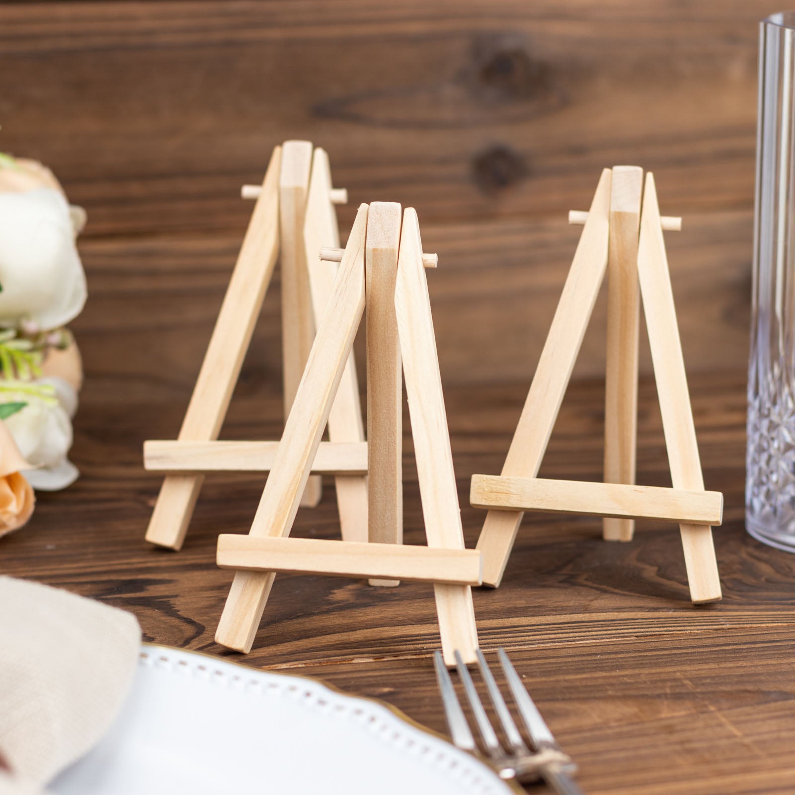 Natural wooden mini easel table number holders for rustic decor.