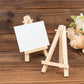 Natural mini rustic wooden easel stands for table number holders.