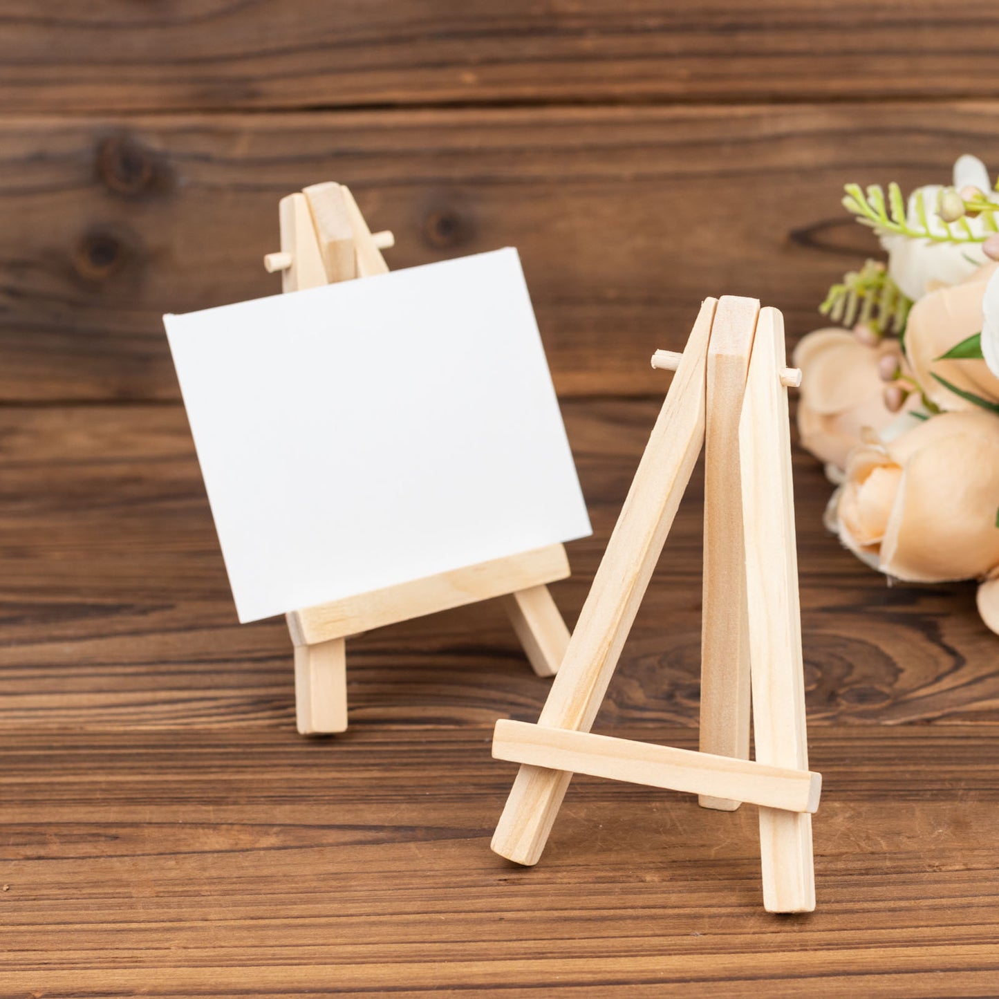 Natural mini rustic wooden easel stands for table number holders.