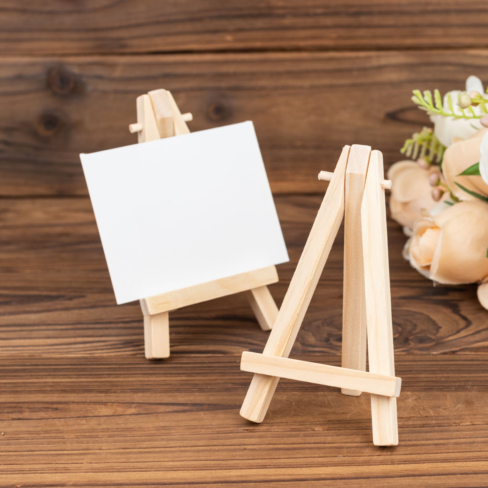 Natural mini rustic wooden easel stands for table number holders.