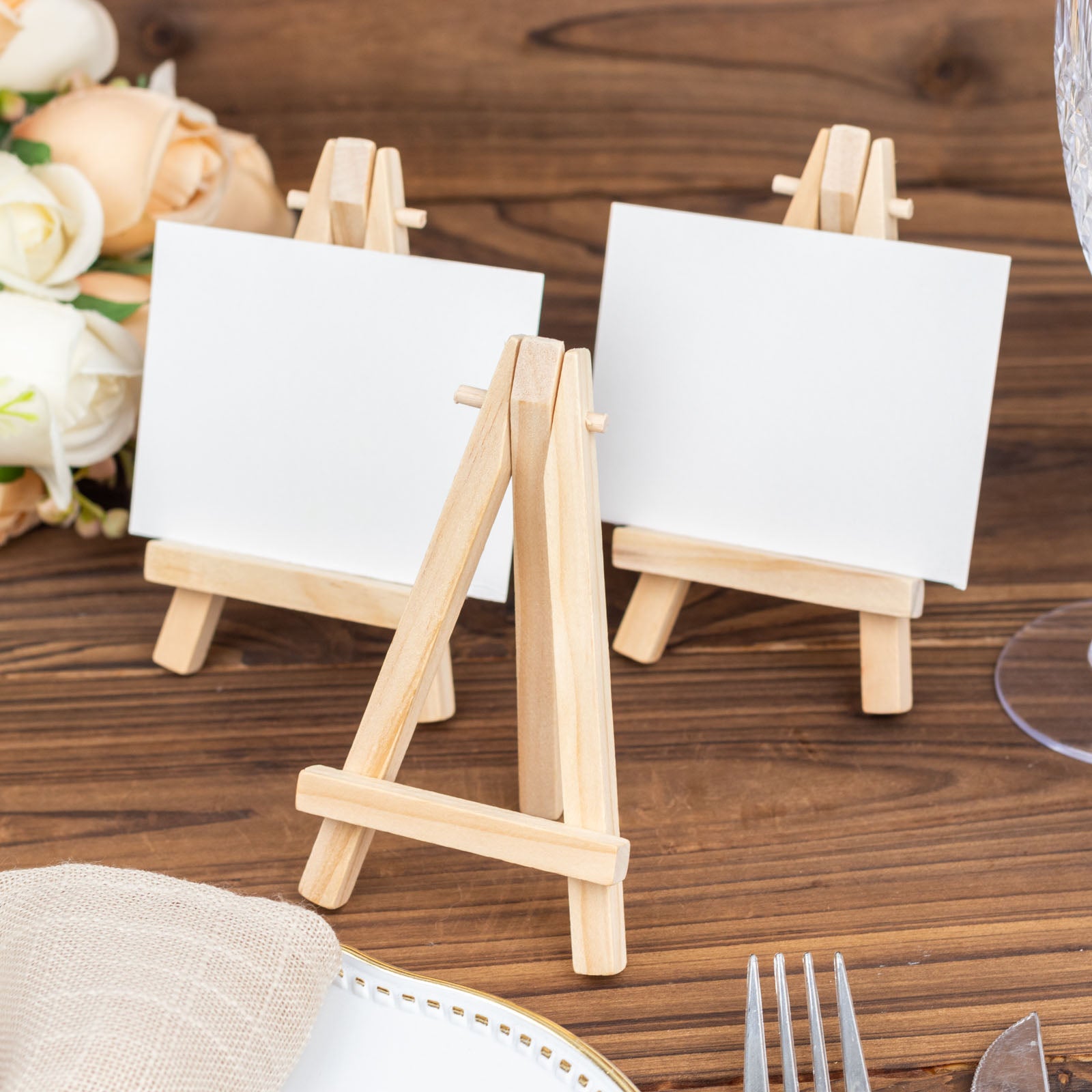 Natural wood mini easel stands for table number and place cards.