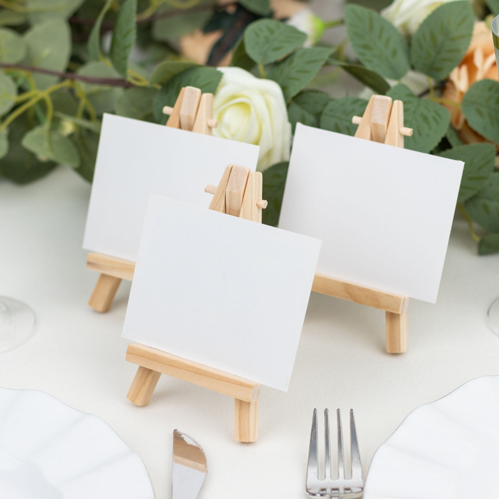 Natural mini rustic wooden tabletop display easel stands for place cards.