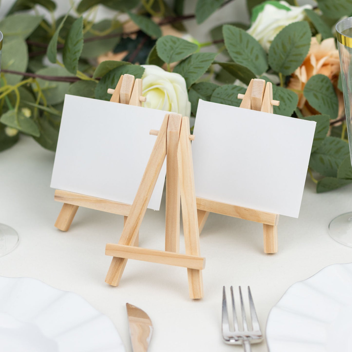 Natural mini rustic wooden display easel stands for table numbers or place cards.