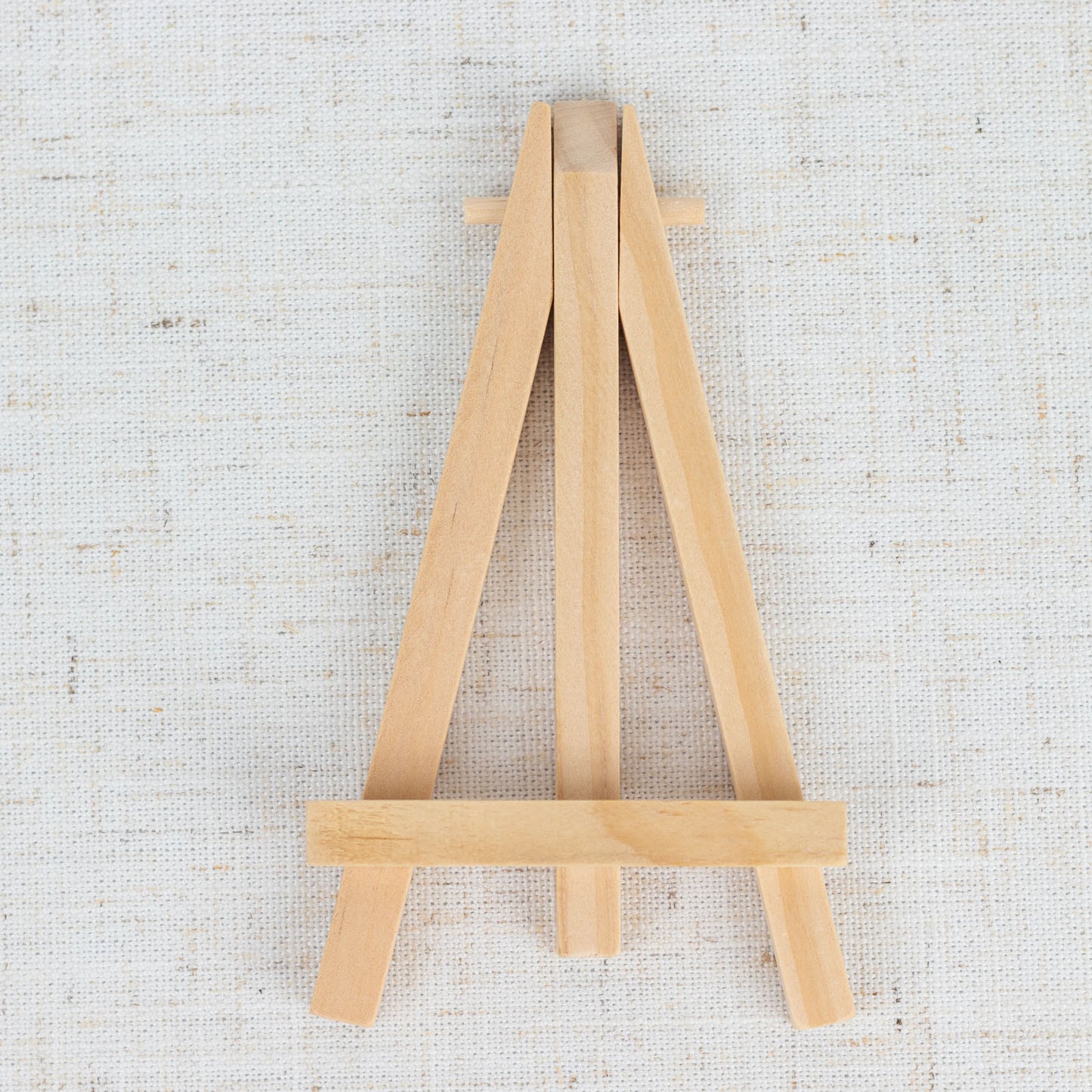 Natural wooden mini easel stands for place cards and table numbers.