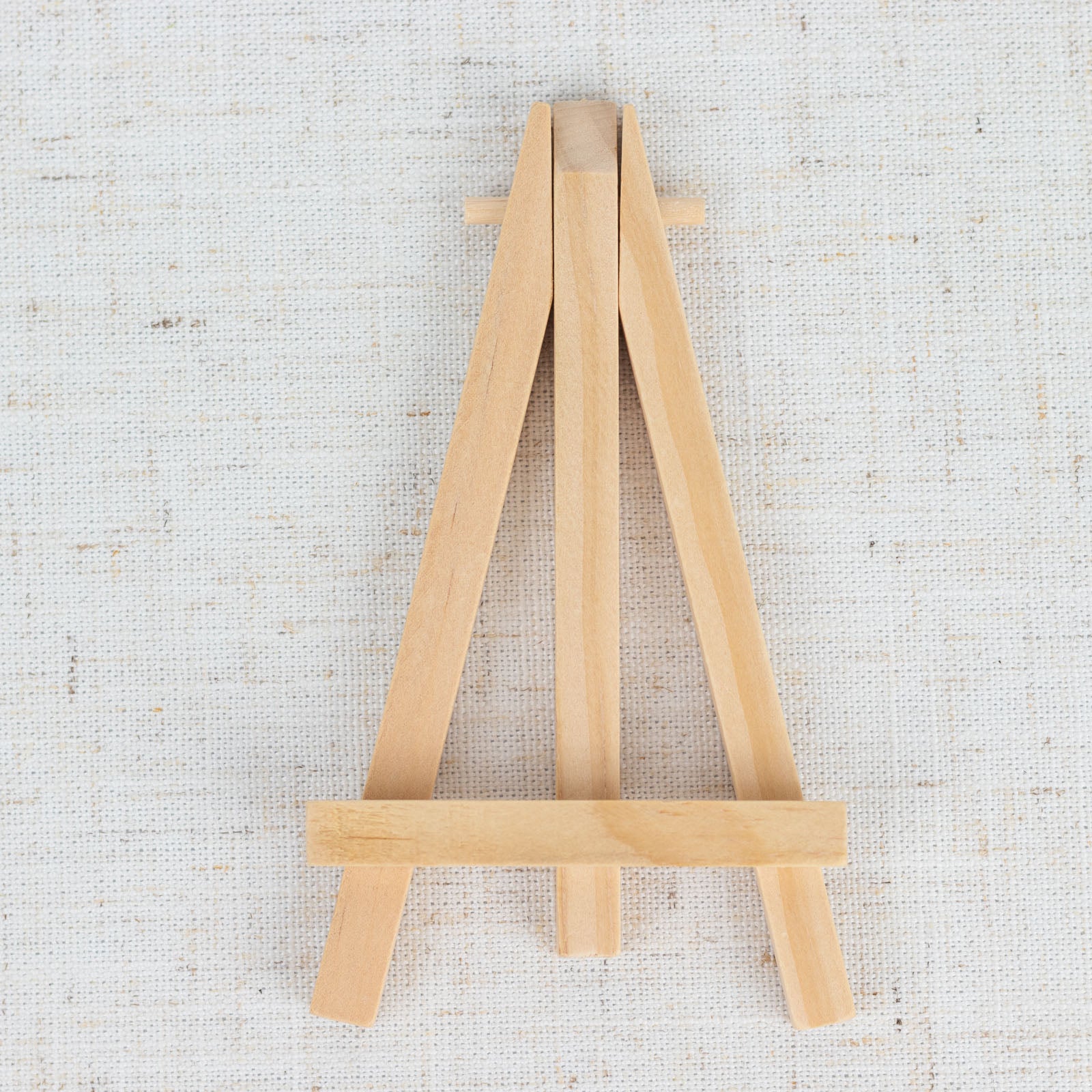 Natural wooden mini easel stands for place cards and table numbers.