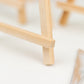 Natural mini rustic wooden place card holders for table settings.