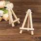 Natural wooden mini easel stands for table number displays.
