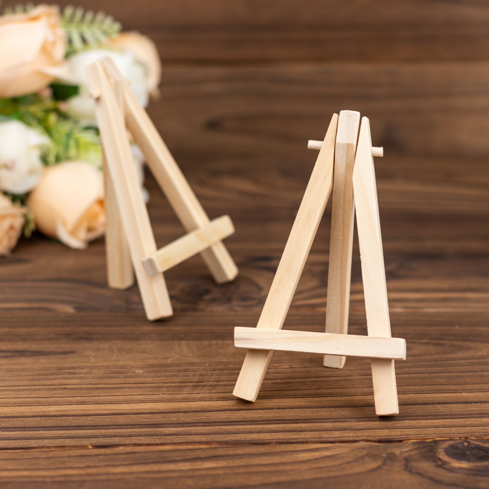 Natural wooden mini easel stands for table number displays.