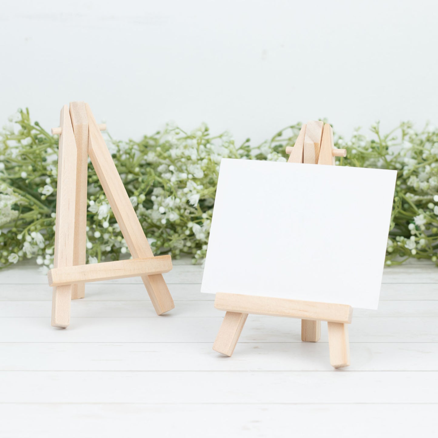 Natural mini rustic wooden tabletop easel stands for place cards.