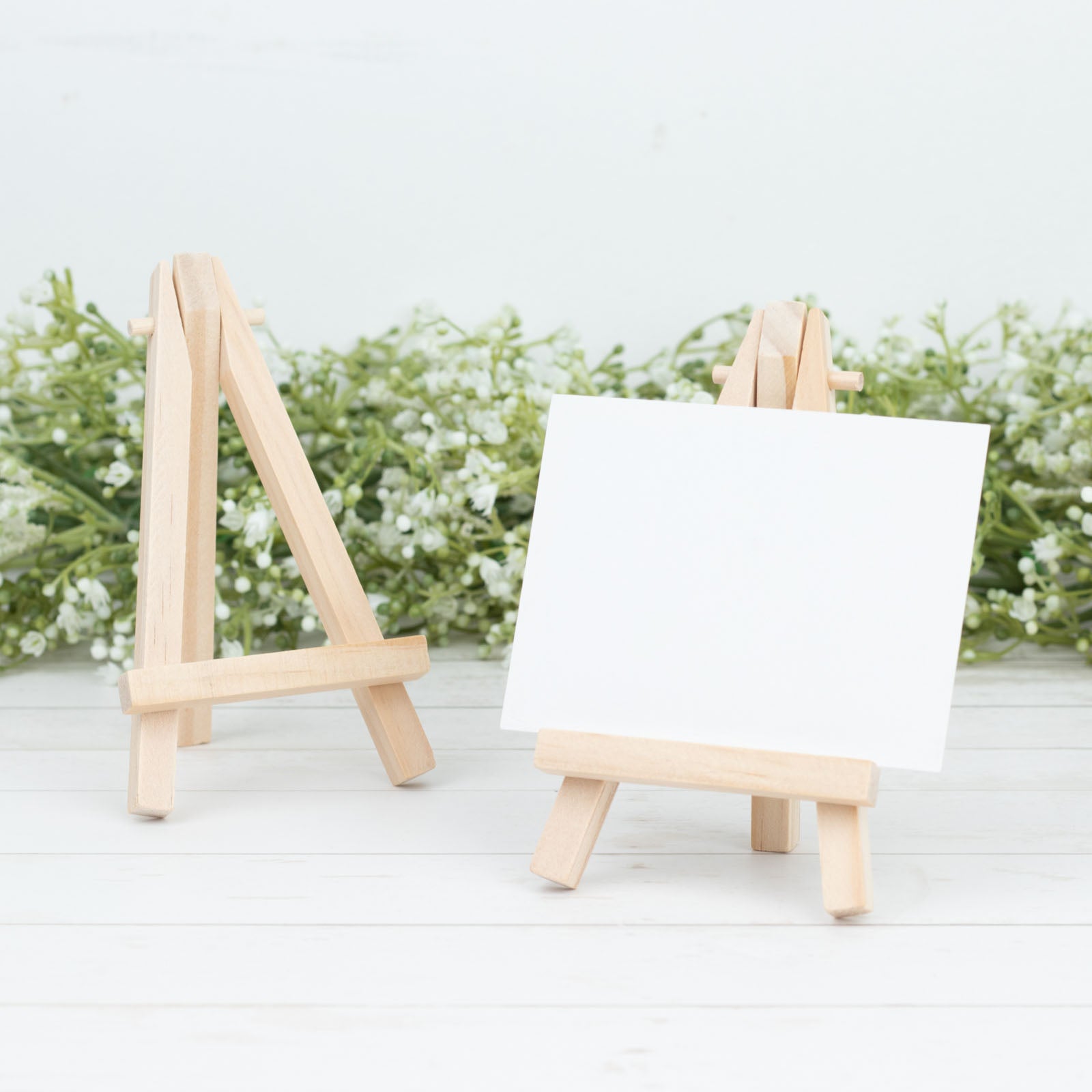 Natural mini rustic wooden tabletop easel stands for place cards.