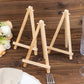 Natural wood small rustic place card holders on a table.