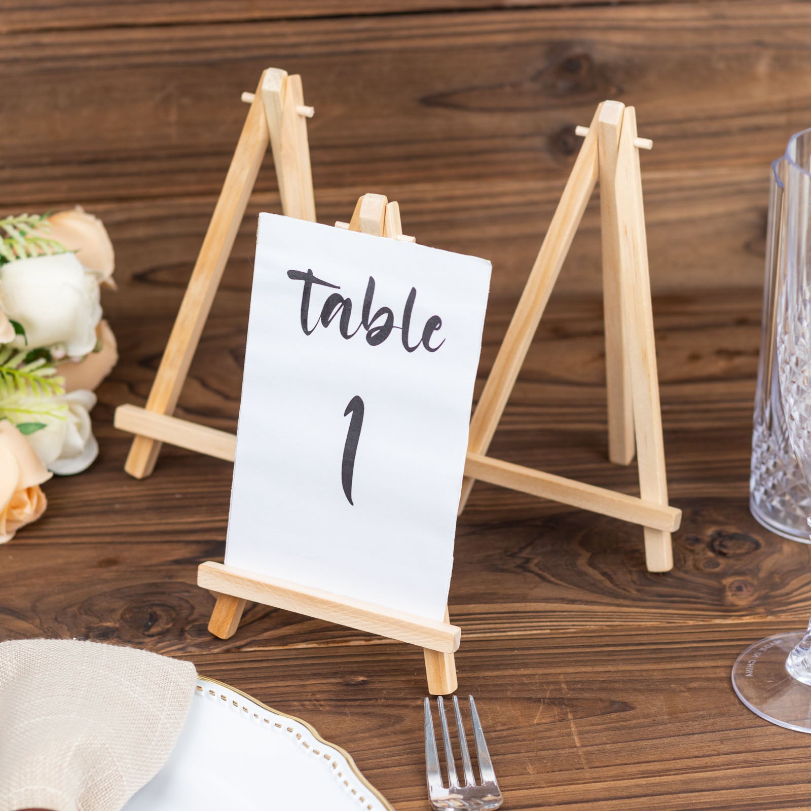 Natural small rustic wooden tabletop easel stands for place cards.
