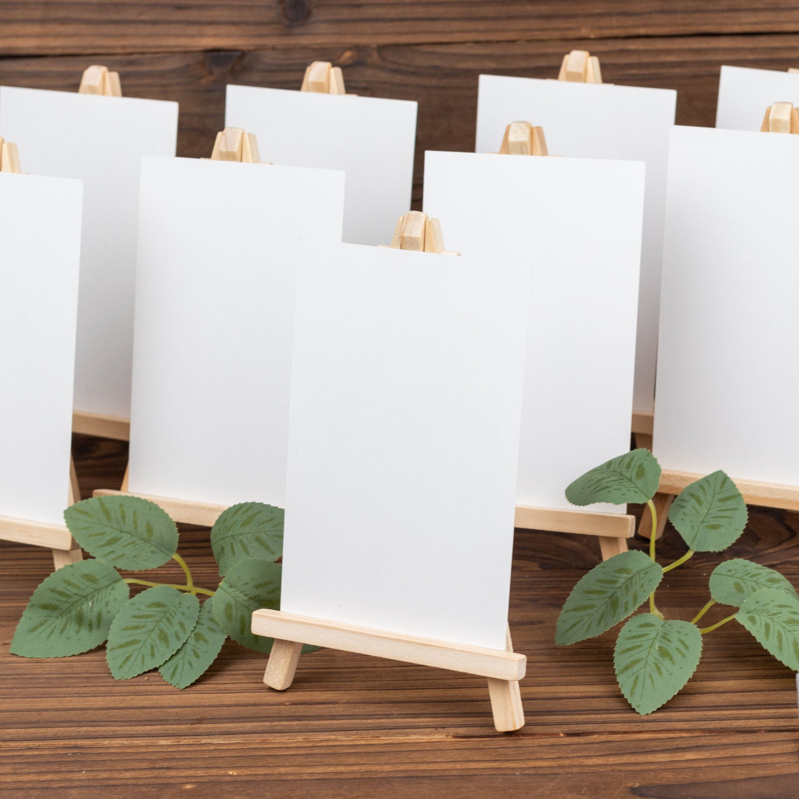 Natural small rustic wooden table number holders with blank cards.