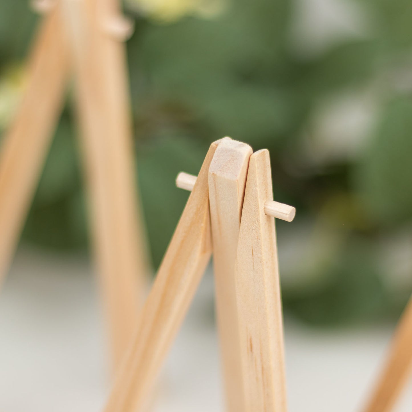 Natural wooden tabletop display easel stands for rustic place cards.