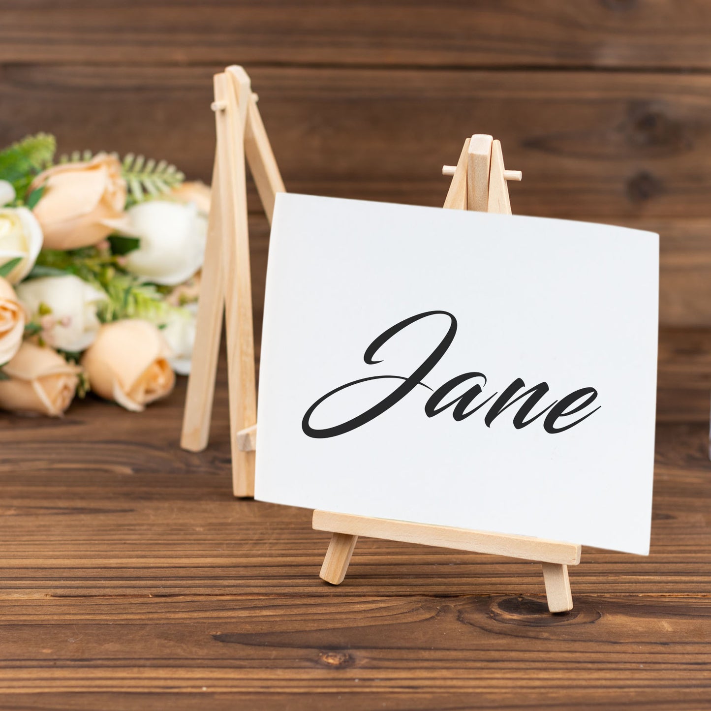 Natural small rustic place card holder with white card and wooden easel.