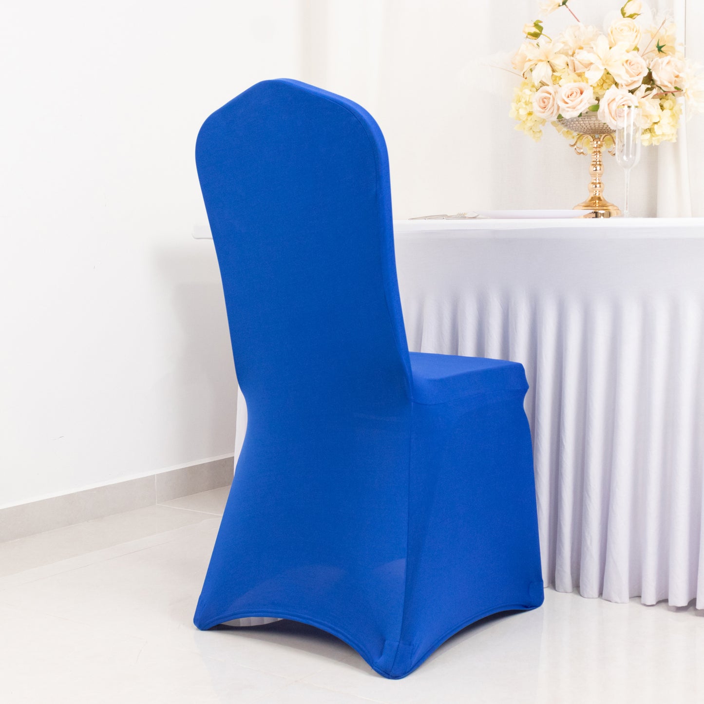 Royal blue fitted banquet chair cover with foot pockets.