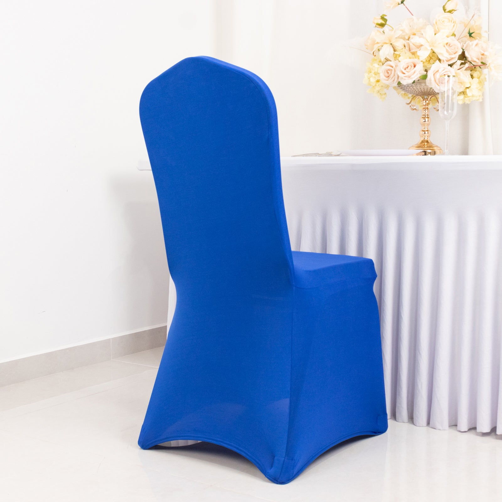 Royal blue fitted banquet chair cover with foot pockets.