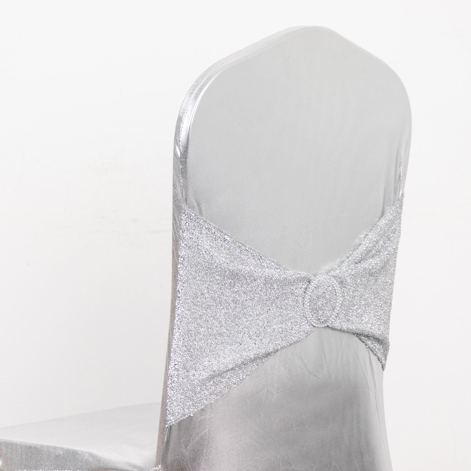 Metallic silver shimmer tinsel spandex banquet chair cover with sash.
