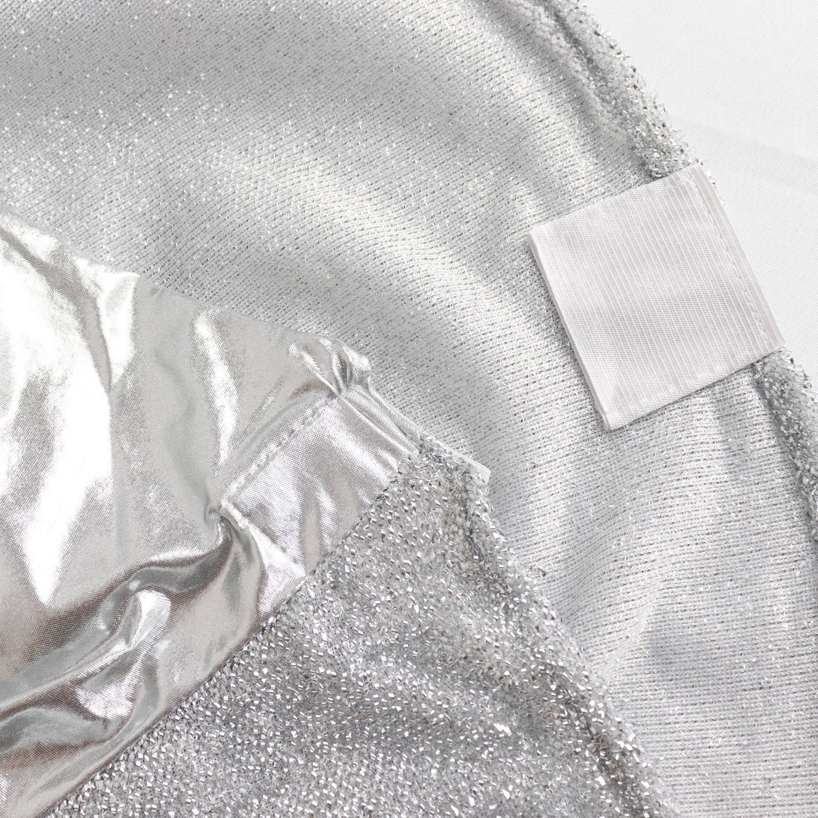 Metallic silver shimmer tinsel spandex banquet chair cover with attached sash.