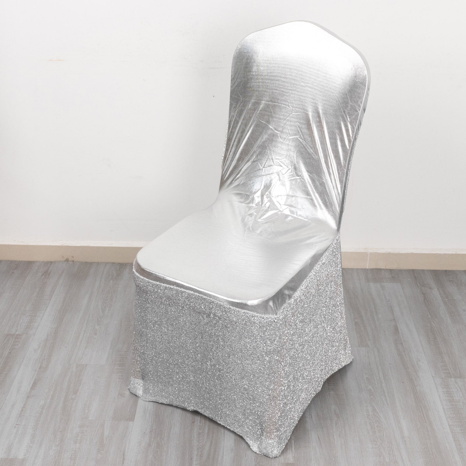 Metallic silver shimmer tinsel spandex banquet chair cover with attached sash.