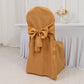 Gold banquet chair cover with attached sash for wedding decor.