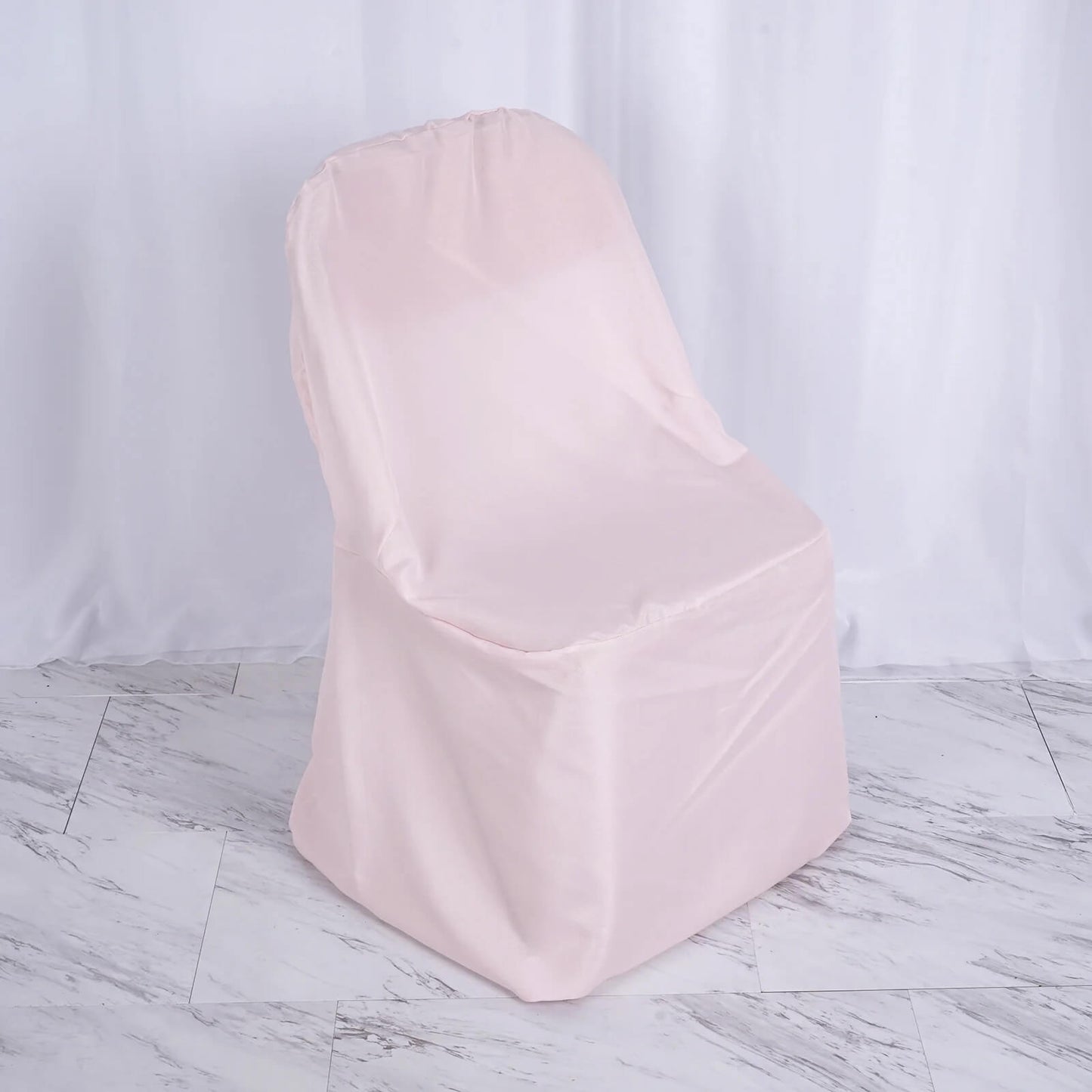 Blush polyester folding chair cover for events and decoration.