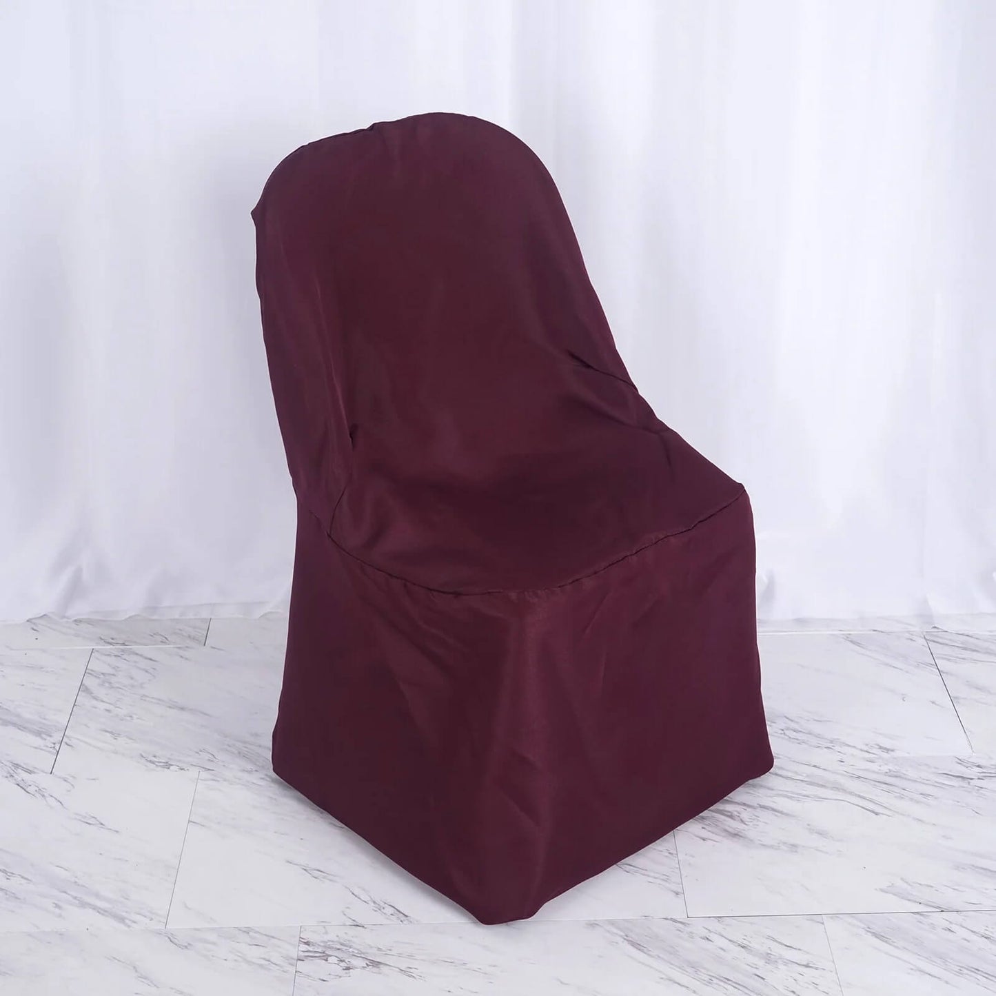 Burgundy polyester folding chair cover, reusable and stain resistant.