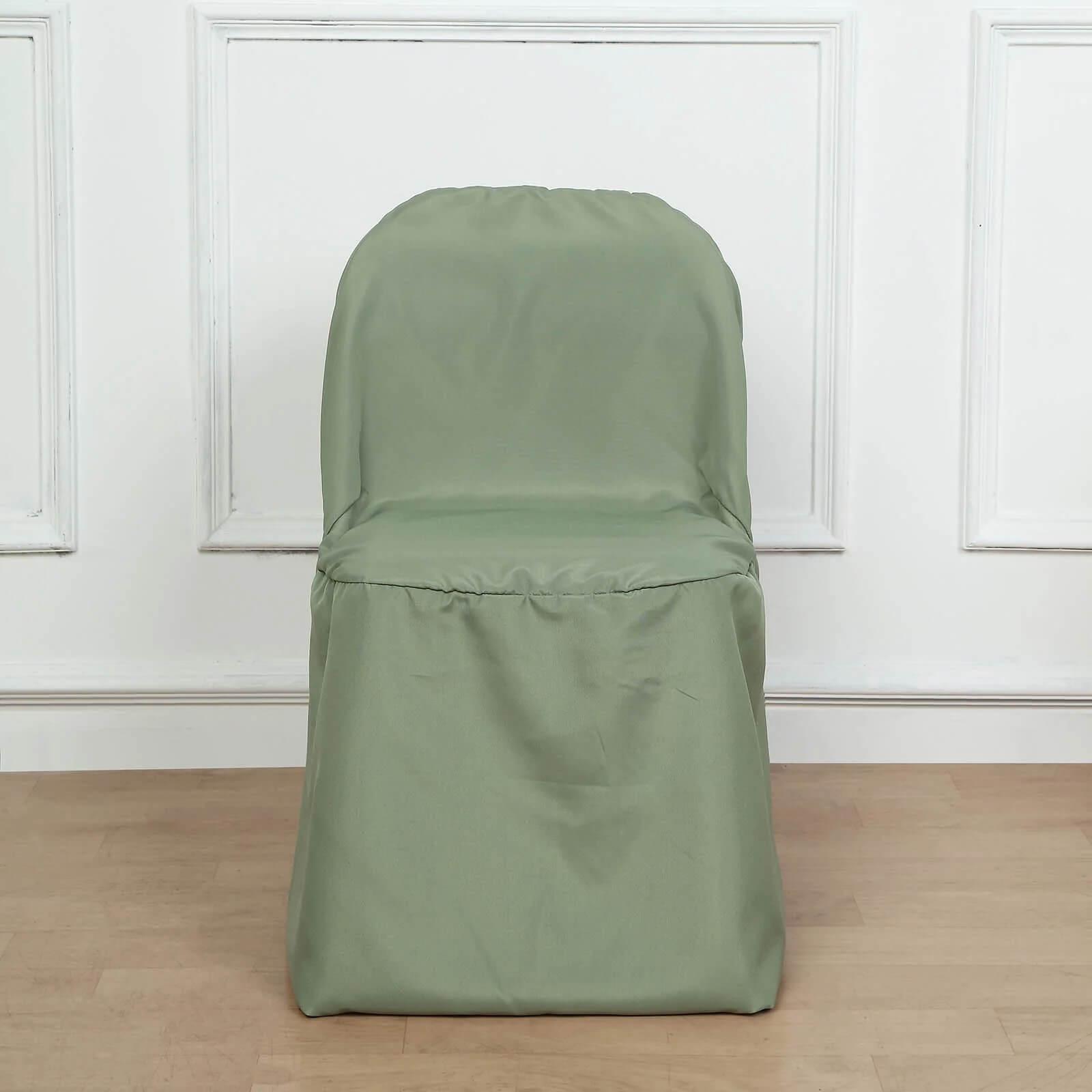 Dusty sage green polyester folding chair cover on a chair.