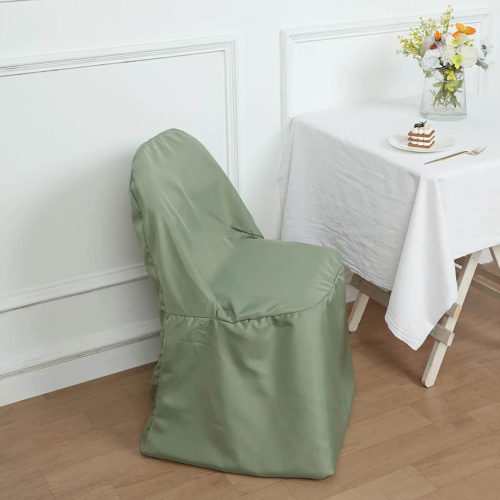 Dusty sage green polyester folding chair cover on a chair.