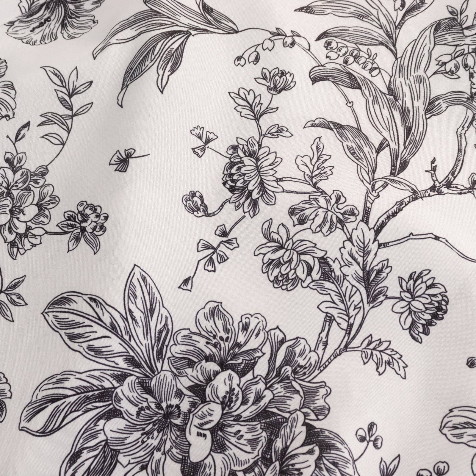 White and black French toile pattern chair cover for folding chairs.