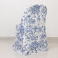 White blue chair cover with French toile pattern on a folding chair.
