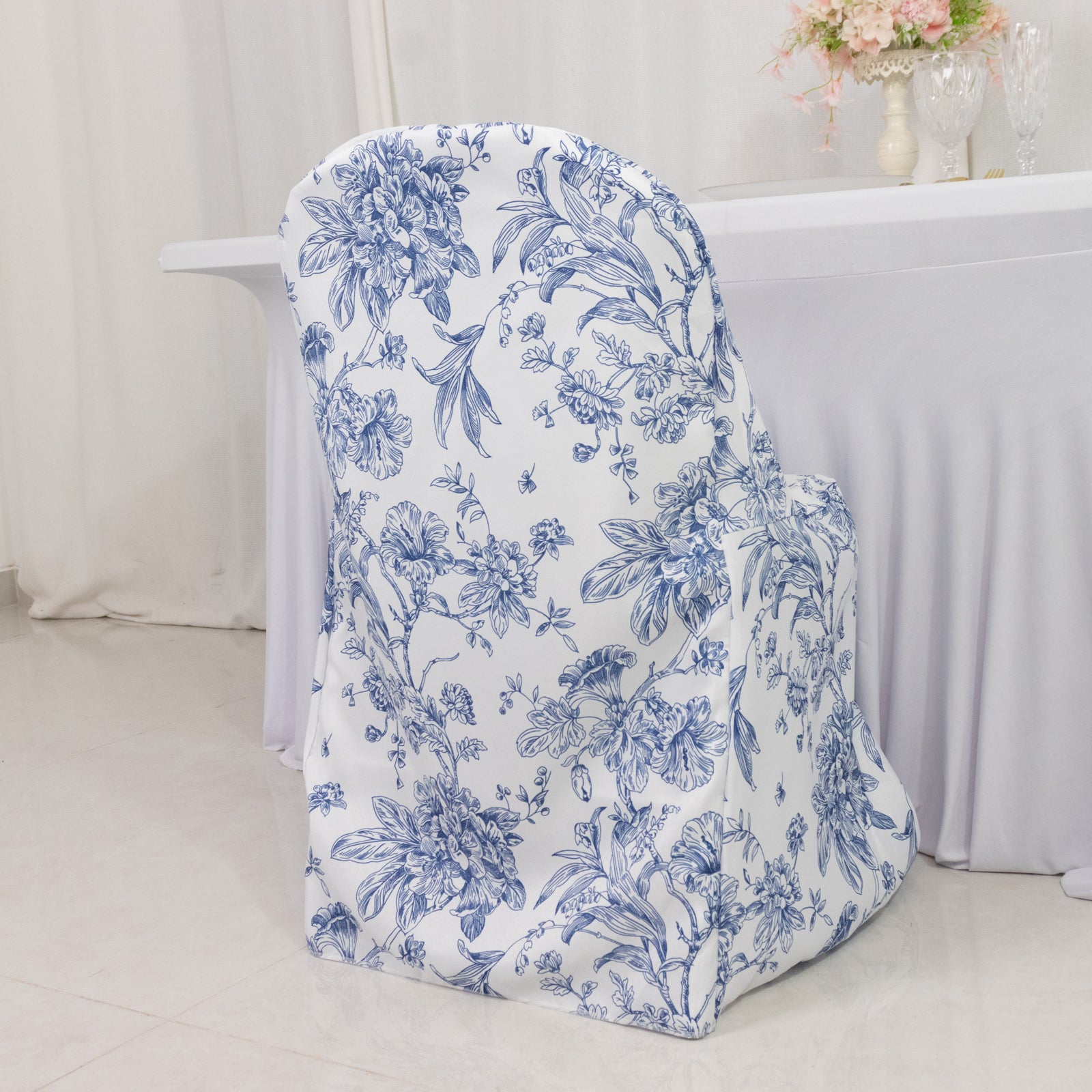 White blue chair cover with French toile pattern for folding chairs.