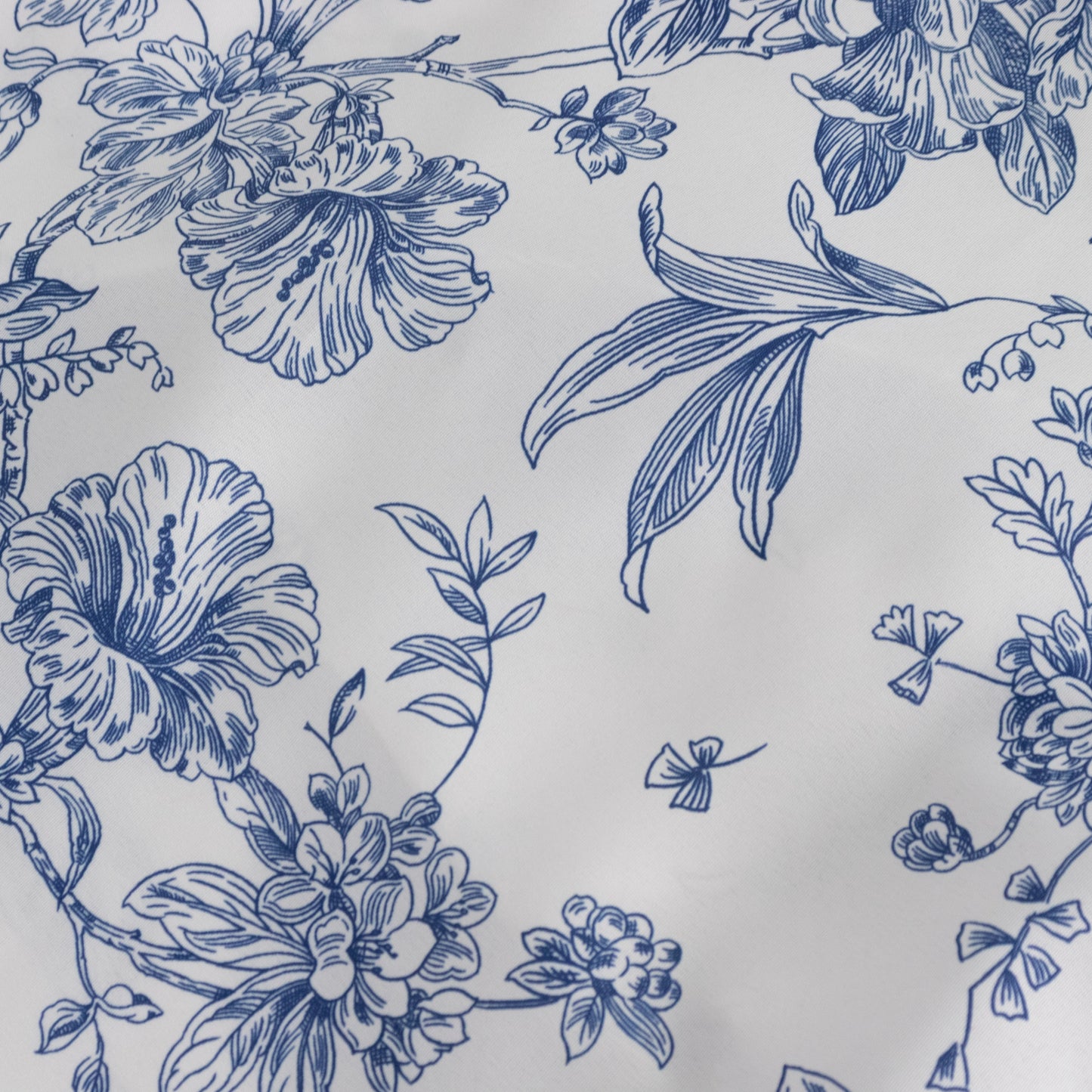 White blue floral chair cover with French toile pattern.