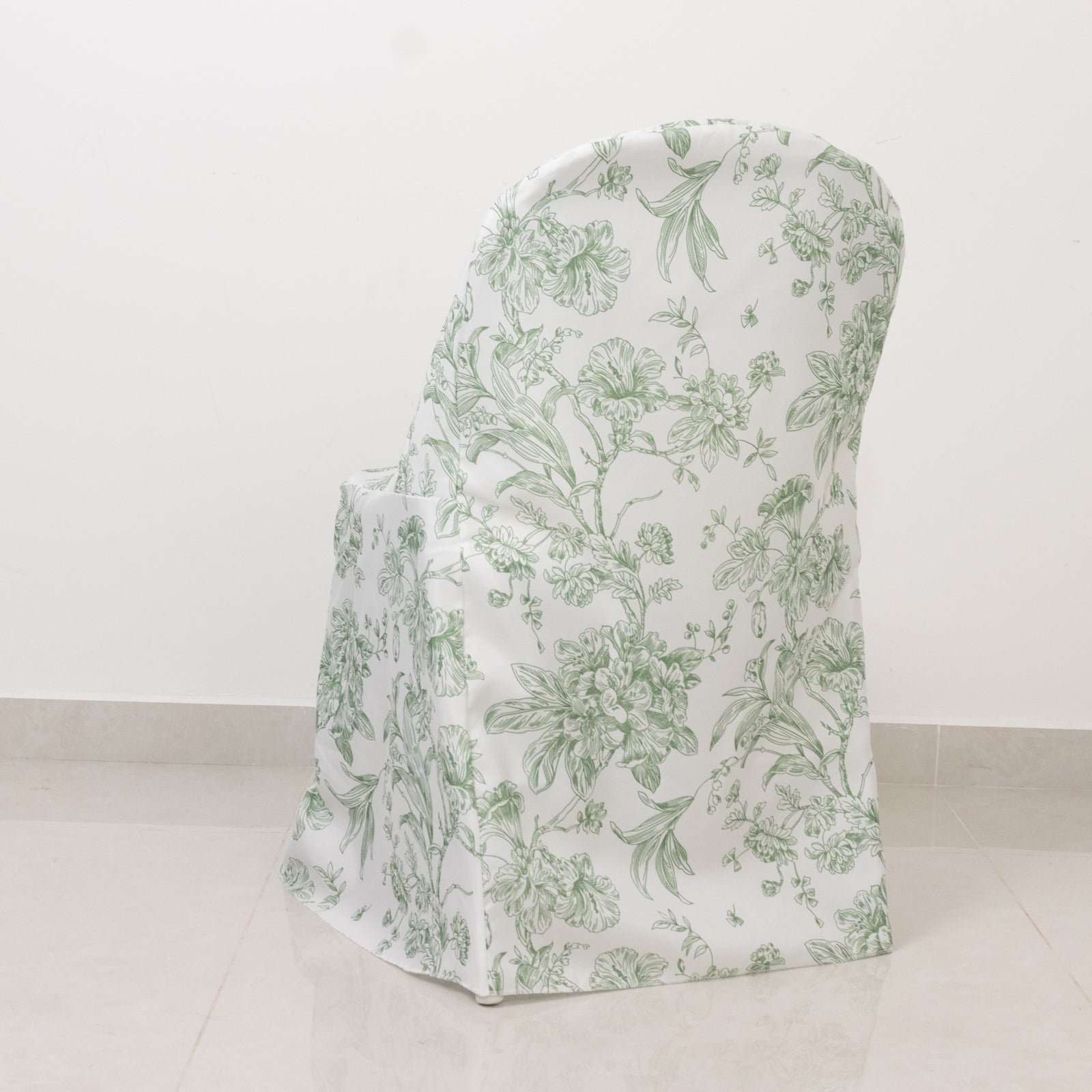 White and dusty sage green chair cover with French toile pattern for folding chairs.