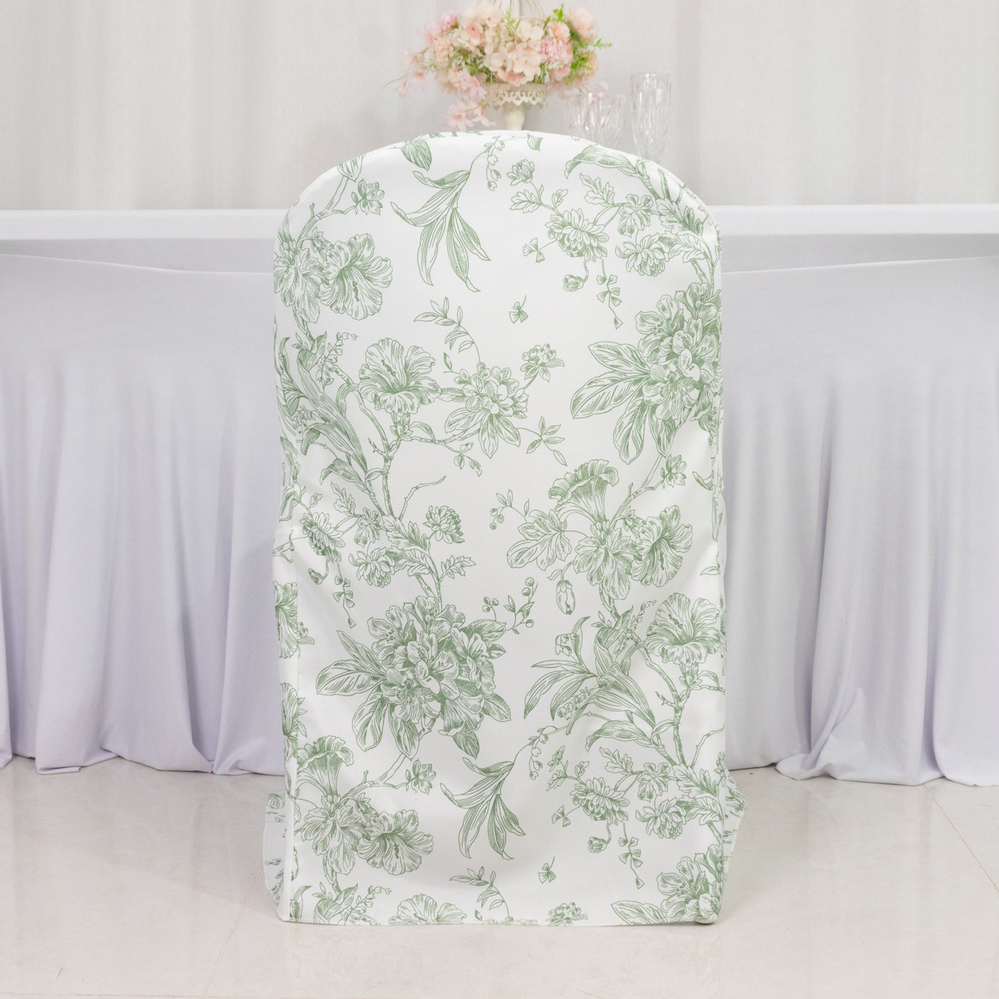 White and dusty sage green floral folding chair cover.