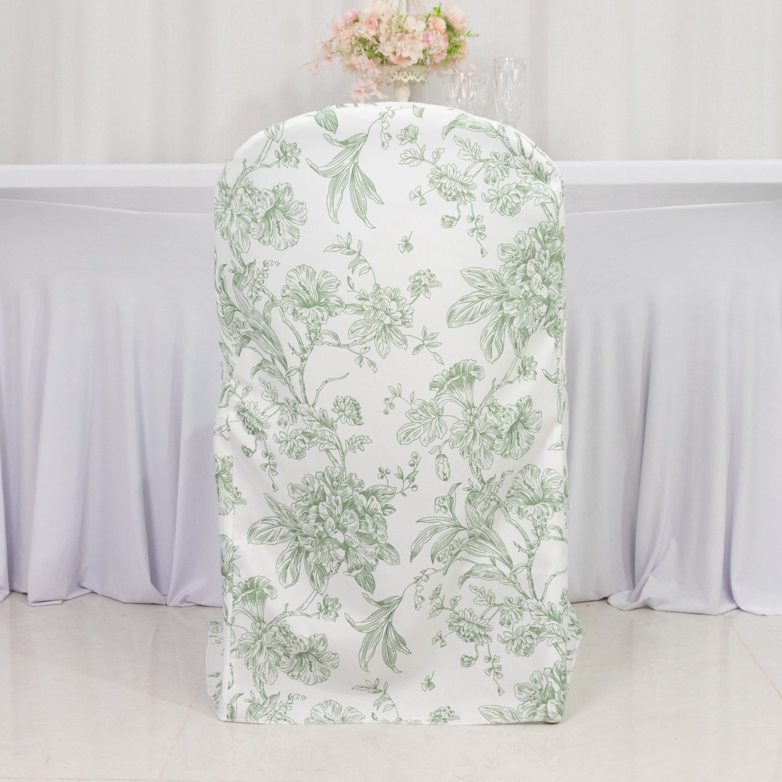 White and dusty sage green floral folding chair cover.