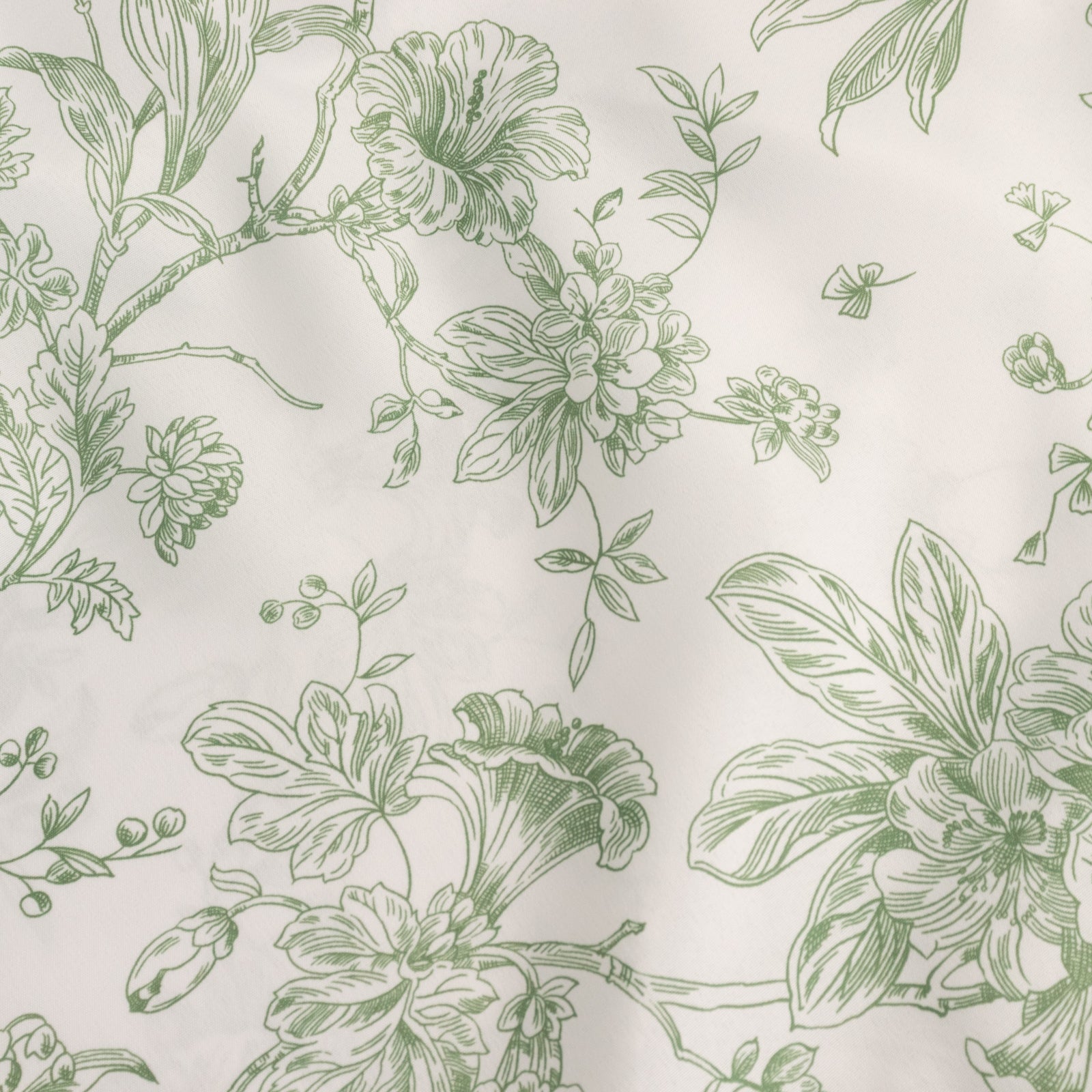 White and dusty sage green French toile pattern chair covers.