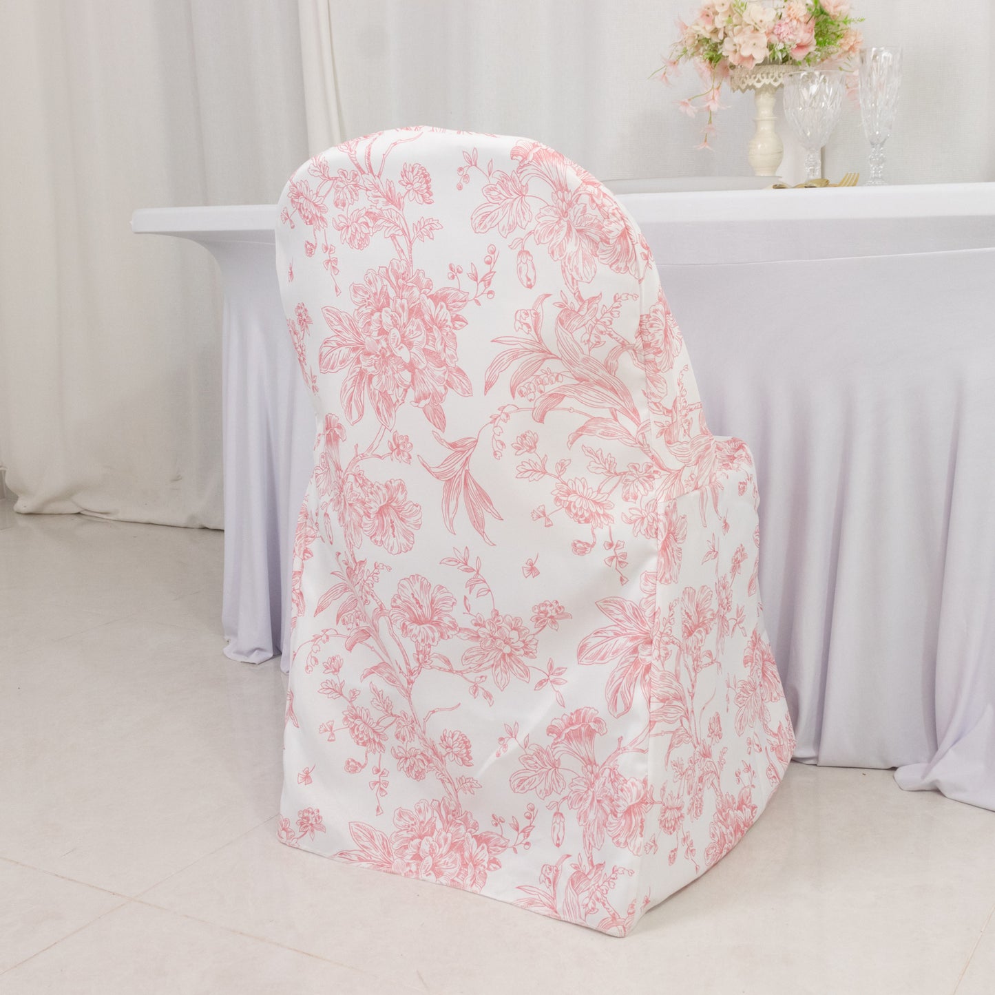 White pink floral chair cover for folding chairs, reusable and stain-resistant.