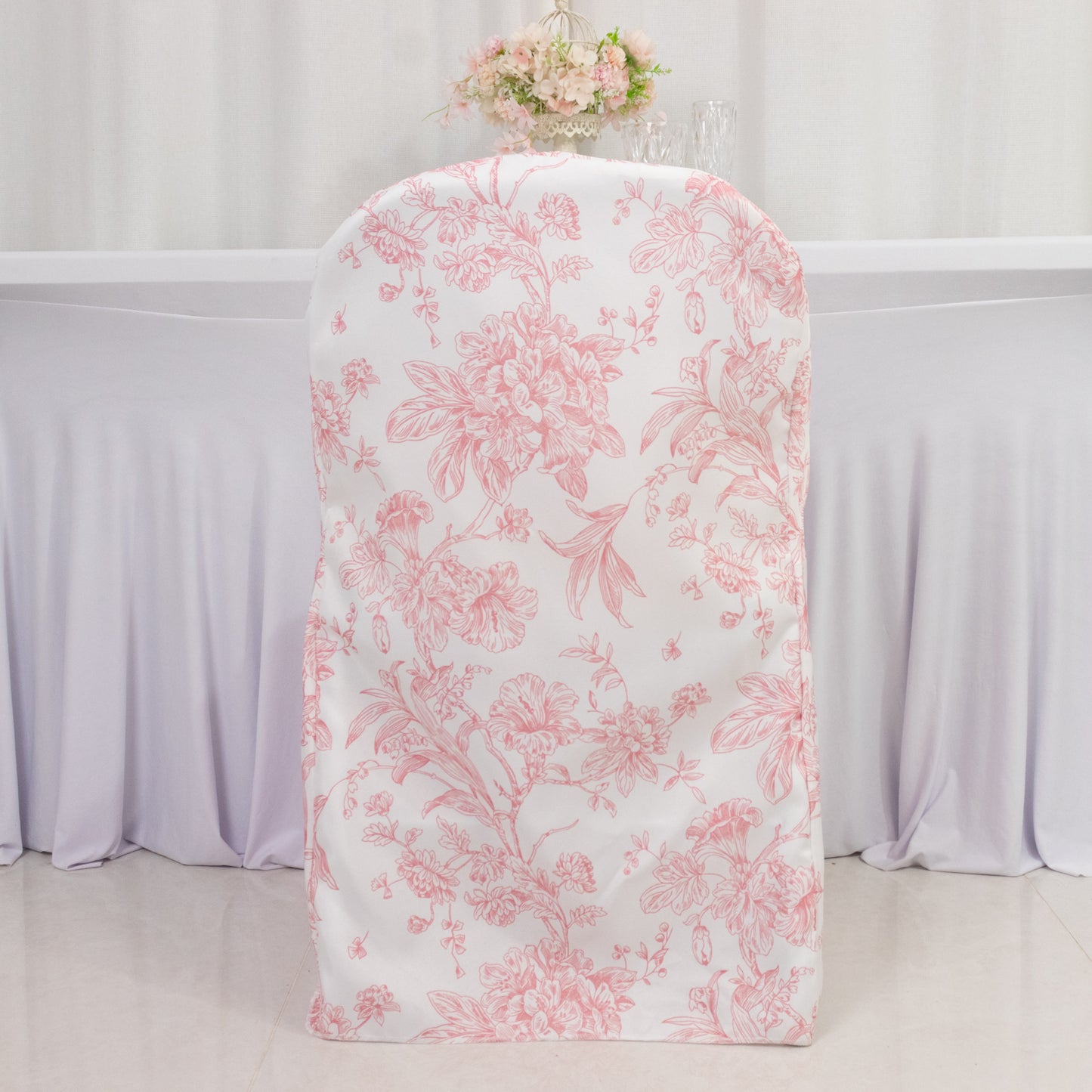 White pink French toile patterned chair cover for folding chairs.