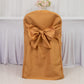 Gold polyester slip-on folding chair cover with attached sash for events.