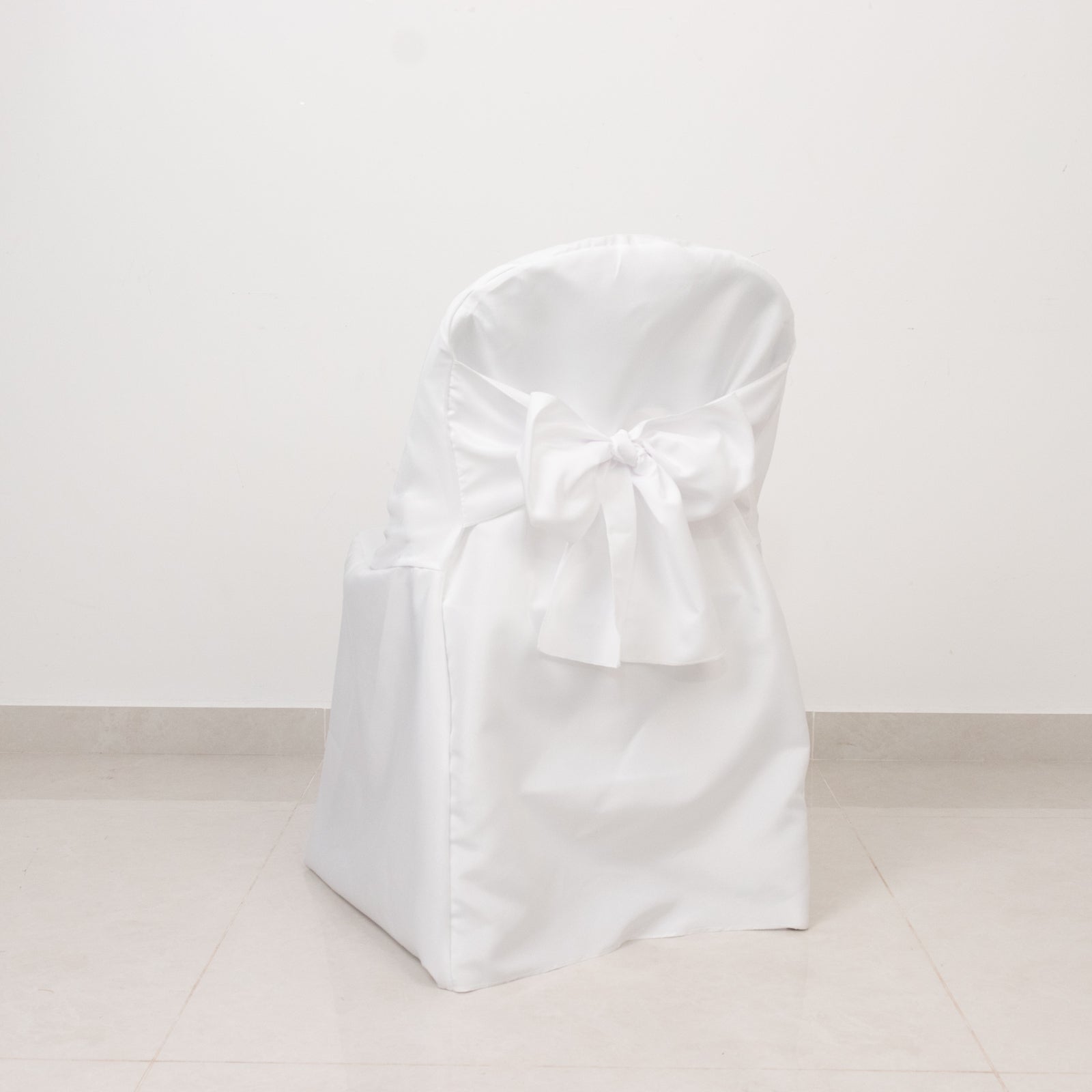 White polyester slip-on folding chair cover with attached sash.