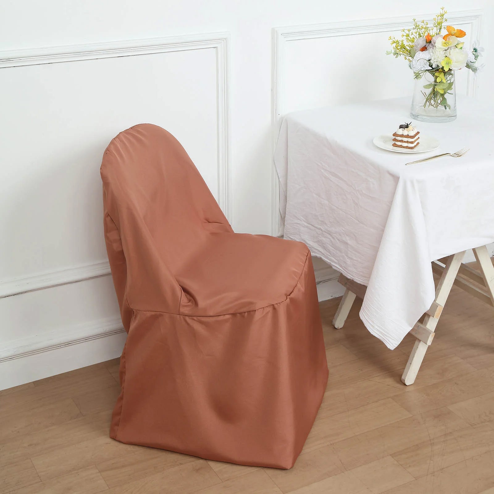 Terracotta polyester folding chair cover, reusable and stain-resistant.