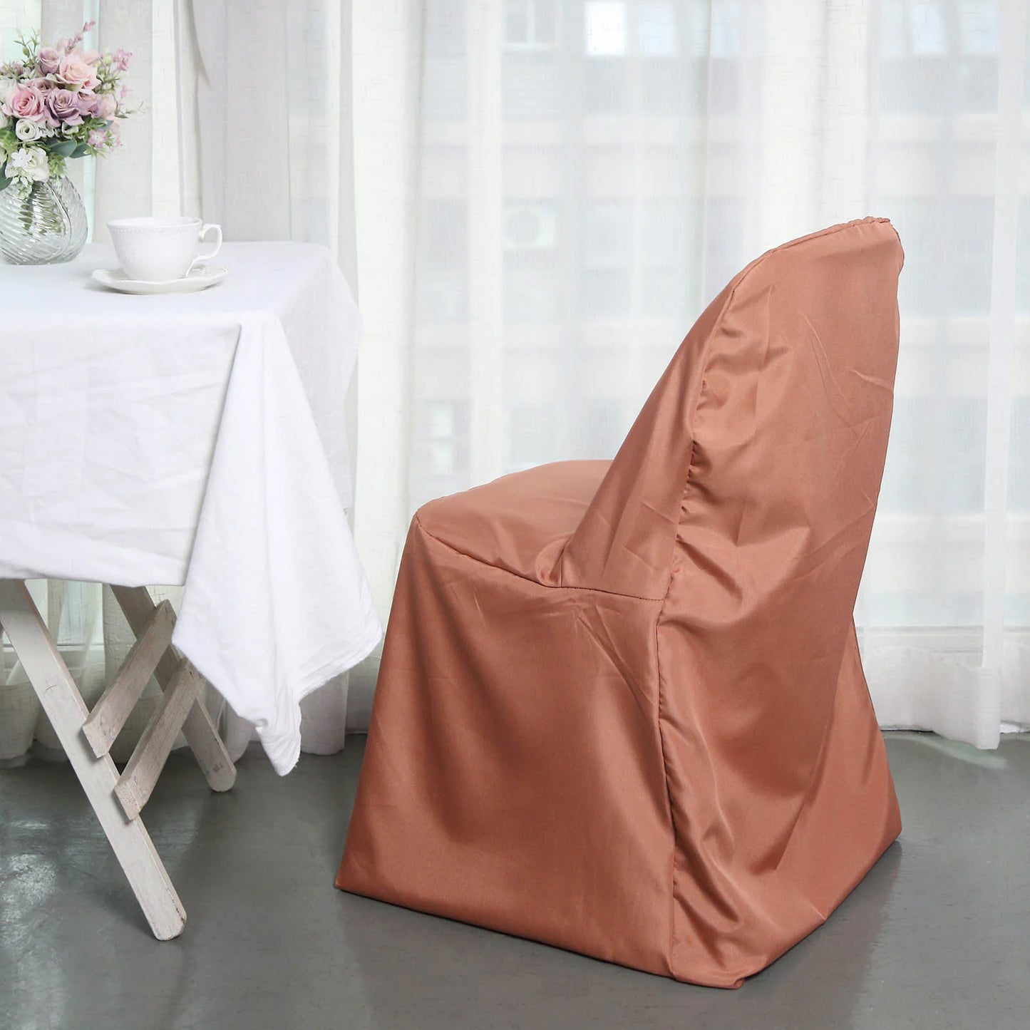 Terracotta polyester folding chair cover, reusable and stain-resistant.